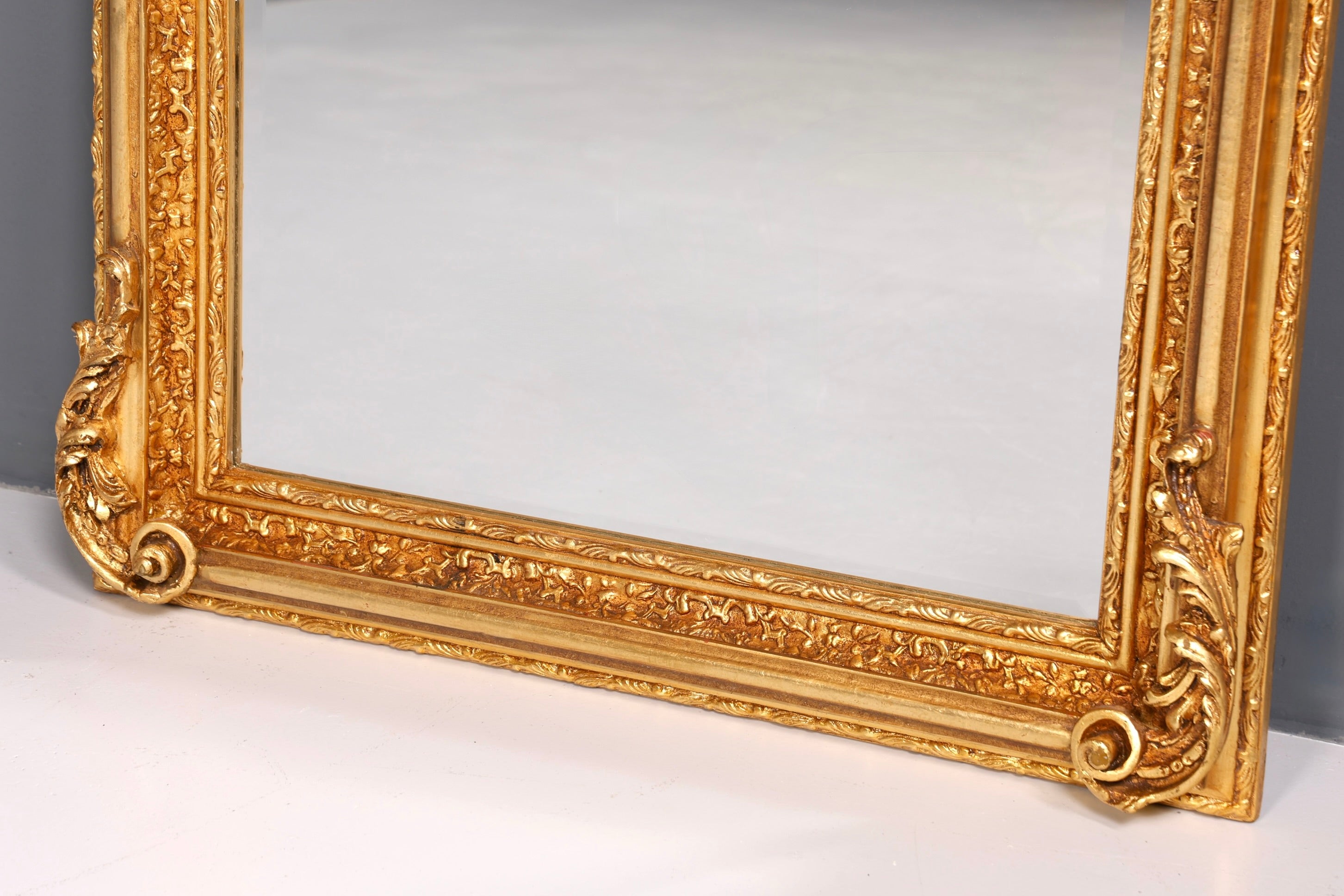 Beautiful, ornate Baroque-style wall mirror with ornaments, hallway mirror, gold mirror