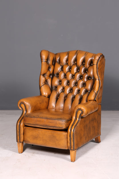 Beautiful original Chesterfield wingback armchair, English genuine leather gentleman’s chair, recliner with reclining function, vintage