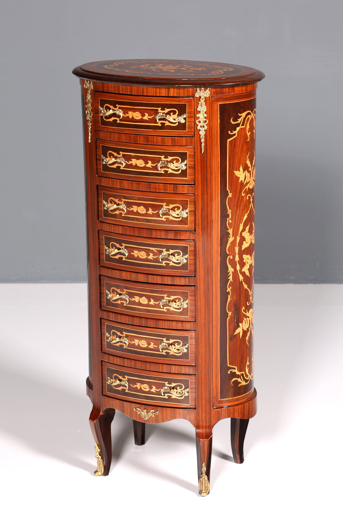 Beautiful oval Baroque style chest of drawers, vertico with inlaid details, 7 drawers