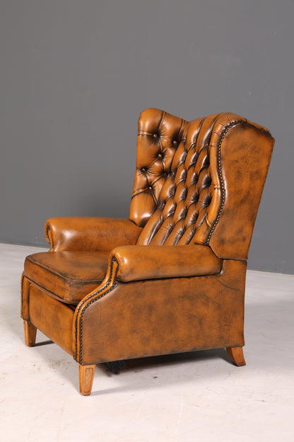 Beautiful original Chesterfield wingback armchair, English genuine leather gentleman’s chair, recliner with reclining function, vintage